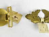 pair of antique brass wall hooks with leaves and leaves on them