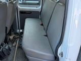 a white van that has a seat in the back of it