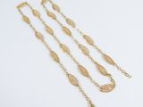 a set of three gold chain bracelets