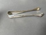 two spoons that are sitting on a table