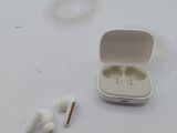 a pair of ear buds sitting on a table next to a pair of ear buds