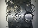 a rack with pots and pans hanging on the wall