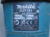 a close up of a blue parking meter with a sticker on it