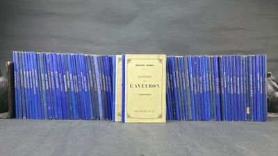 a group of books sitting on top of a table next to each other