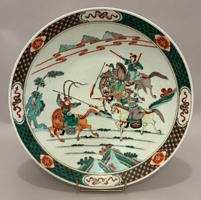 an image of a plate with a picture of a man riding a horse