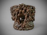 a close up of a sculpture of a lion head on a table