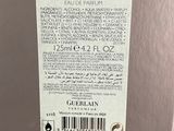 the back of a silver refrigerator with a label on it