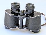 a pair of binoculars that are sitting on a white surface