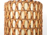 a lamp that is made out of yarn and a lamp shade