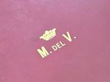 purple leather case with a gold crown on the front of it