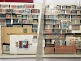 a lot of stamps on display in a display case