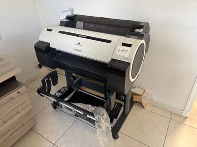 an image of a printer sitting on top of a stand