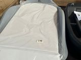 a baby bed in the middle of a pile of boxes
