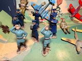a lot of figurines that are sitting on a table
