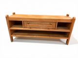 an image of a wooden tv stand with drawers
