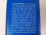 the back cover of a blue book with a picture of a cat on it