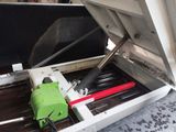 a machine that has a green tool inside of it
