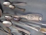 a lot of spoons and spoon spoons on the table