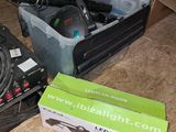 a box of tools sitting on the floor next to a box of wires