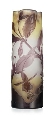 a vase with a bird on it sitting on a table