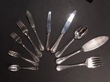 a lot of forks and spoons arranged in a circle
