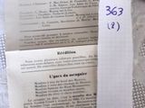 a piece of paper on a table with a piece of paper on top of it