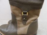 a close up of a pair of boots with a zipper
