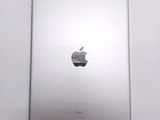 an apple ipad sitting on top of a white table next to a white wall