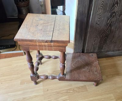 a small wooden table with a wooden chair next to it