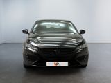 the front view of a black car in a white room
