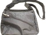 a black purse with a zipper on the side