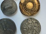 a lot of coins that are sitting on a table