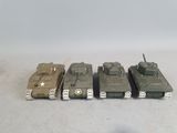 four toy tanks sitting next to each other on a table