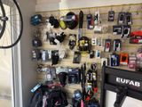 a bike hanging on the wall in a bike shop