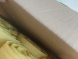 a person that is putting cheese in a box