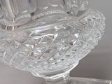 a glass vase that is sitting on top of a table