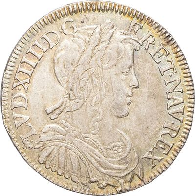 a silver coin with a woman ' s head on it