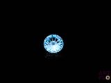 a close up of a blue diamond on a black background
