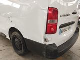 a white van that is parked in a parking lot