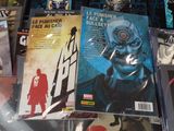 a lot of comic books on the table