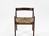 a wooden chair with a leather seat and backrest on a white background