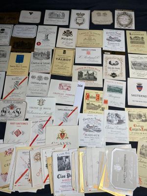 many different types of wine labels on the table