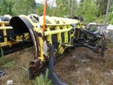 a tractor that is sitting in the grass