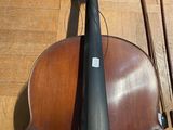 a violin that is sitting on the floor with its bow