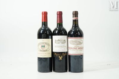 trois bouteilles de vin posées l'une à côté de l'autre sur une table