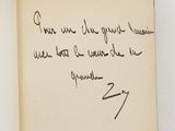 an open book with a handwritten poem on it