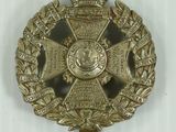 an image of a badge with a crown on top of it