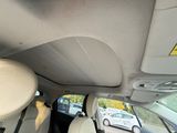 a view of the inside of a car from the driver ' s seat