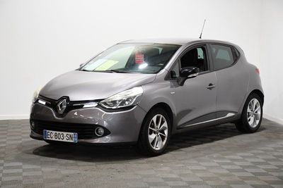 a grey car is parked in a room with a checkered floor