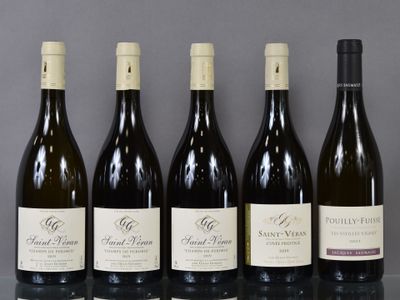 six bottles of wine are lined up in a row on a table